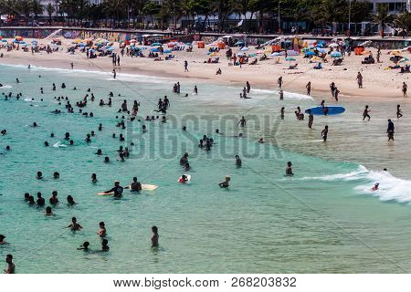 Rio De Janeiro, Brazil - January 27, 2015: People Enjoy The Famous Beach Ipanema In Rio De Janeiro.