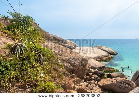 Rio De Janeiro, Brazil - January 27, 2015: People Swim In A Sea At Pedra Do Arpoador Rock Between Ip