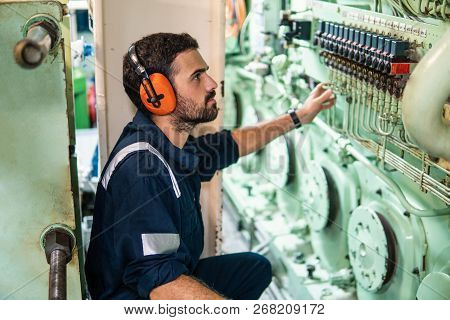Marine Engineer Officer Working In Engine Room
