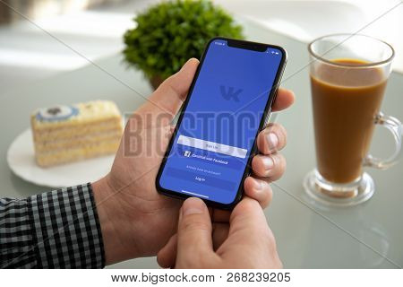 Alushta, Russia - November 6, 2018: Man Holding Iphone X With Social Networking Service Vk On The Sc
