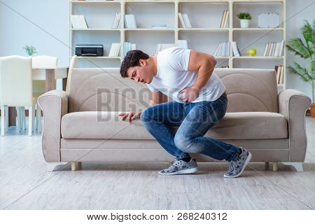 Sick man suffering at home from infection and bad stomach