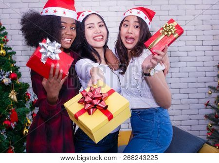 Christmas And Happiness Concept - Smiling Sandy Girl Holding Many Gift Boxes.
