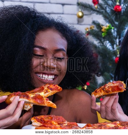 Friendship Enjoy Eating Pizza On A Table.