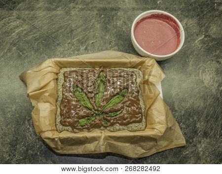 Cooking Of Marijuana Poppy Seed Cake With Chocolate And Pink Fruit Glaze