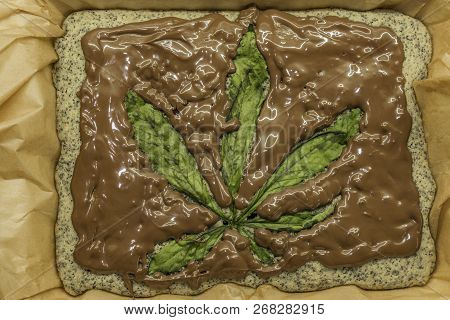 Cooking Of Marijuana Poppy Seed Cake With Chocolate And Pink Fruit Glaze