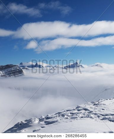 Snowy Slope And Sunlight Mountains Under Clouds At Cold Sun Day. Caucasus Mountains In Winter, Georg