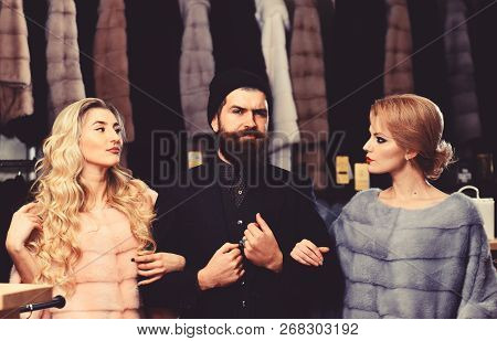 Friends In Shop: Ladies And Gentleman In Expensive Overcoats