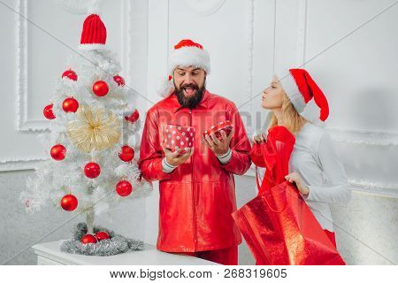 Happy Family Preparing To New Year. Christmas Holiday Party. Santa Claus In Modern Red Jacket. Xmas 