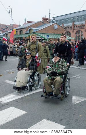 Gdansk, Poland - November 11, 2018: Veteran In Wheelchair For 100th Anniversary Of Regaining Indepen