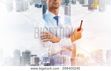 Confident And Young Businessman In Smart-casual Wear Smoking Pipe And Modern Cityscape With Business