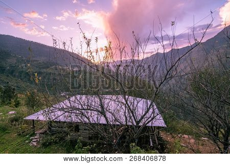 Sunset In Himalayas - Sankri Range, Uttarakhand, India - October 8, 2018 : A Girl Standing Her Tradi