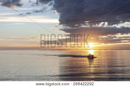 Amazing Sunset Over The Sea With Dramatic Clouds