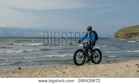 Fat Bike Also Called Fatbike Or Fat-tire Bike In Summer Driving On The Beach.