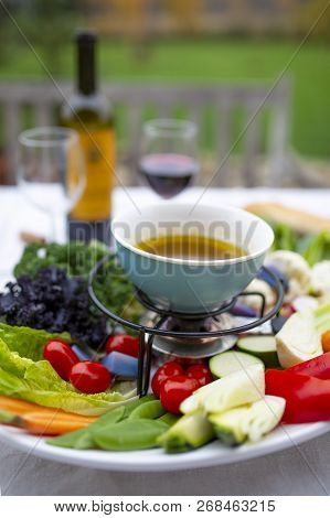 Traditional Italian dish - Bagna cauda. Hot sauce and raw vegetables.