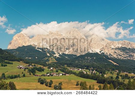Panoramic View Of The Dolomite Mountains. Mountain Village Cortina Di Ampezzo.