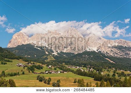 Panoramic View Of The Dolomite Mountains. Mountain Village Cortina Di Ampezzo.