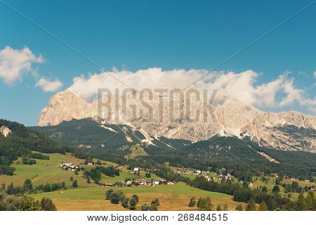 Panoramic View Of The Dolomite Mountains. Mountain Village Cortina Di Ampezzo.