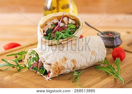 Tortillas Wraps With Chicken And Vegetables On  Wooden Background. Chicken Burrito. Healthy Food.