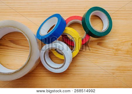 Color Rolls Of Gaffer Tape, Duct Tape, On A Wood Background