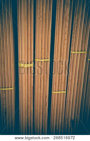 Large Rectanguler Wood Panels Stacked Up Together In Display