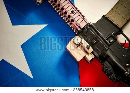 Top View Of A Machine Gun Located On The Background Of The Texas Flag