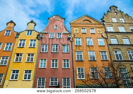 Facade Of Beautiful Typical Colorful Houses Buildings On Piwna Street In Old Historical Town Centre 