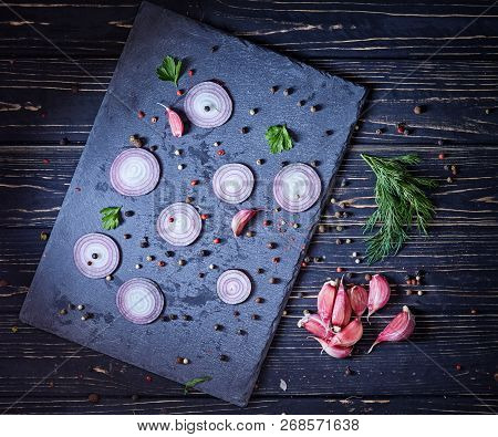 Garlic Near The Onion On The Board
