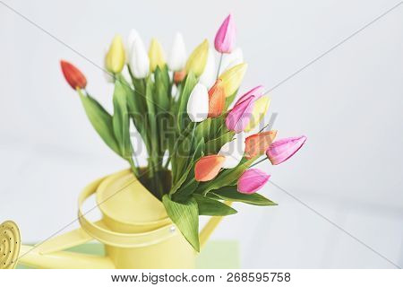 Yellow Funnel With Small Colored Flowers Tulps. Beutiful Spring Flowers.