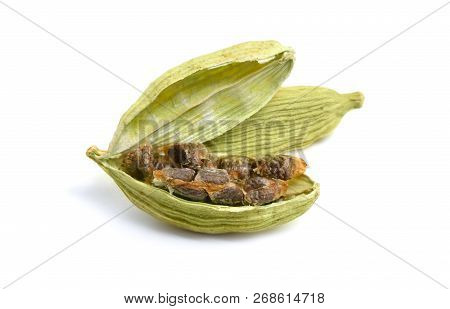 Green Cardamon Seeds Isolated On A White Background.