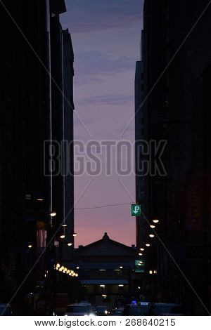Chicago Predawn Light As Seen From Between High Rise Office Buildings With Silhouette Of The Art Ins