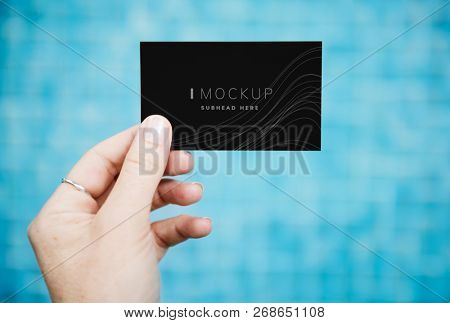 Female hand holding a business card mockup