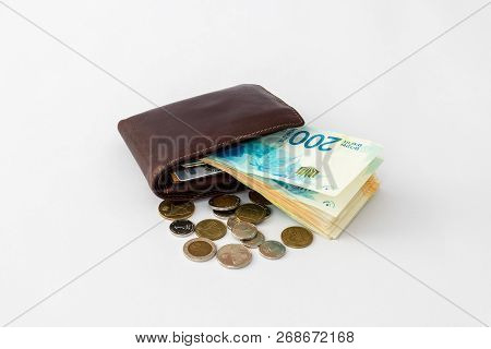 Вrown  Leather Wallet And Stack Of Banknotes And Several Coins Of New Israeli Shekels Isolated On Wh