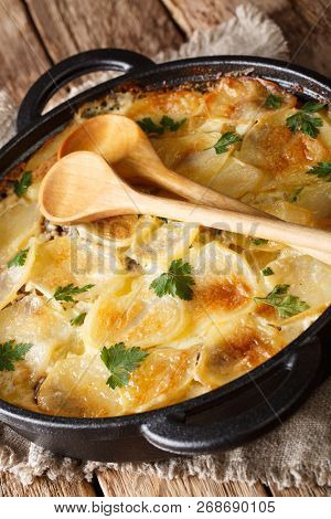 Finnish Cuisine Janssonin Kiusaus. Baked Potatoes With Anchovies, Onions And Cream Close-up In A Fry