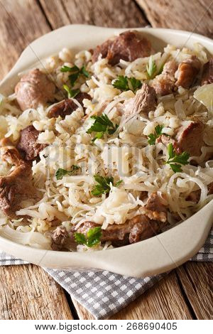 Estonian Slow Stewed Mulgikapsas Pork With Sauerkraut And Barley Close-up On The Table. Vertical