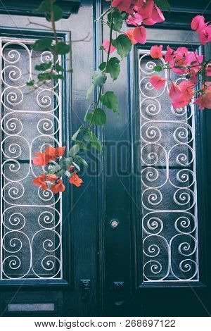 Detail of a traditional house door with flowers