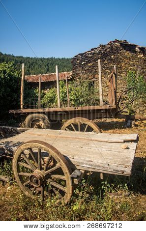 Old abandoned wooden wagons in the rural countryside