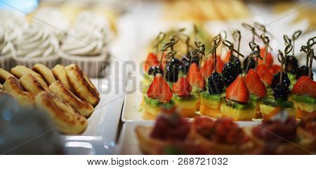 Sweet Desserts Made From Berries, Muffins And Cheesecakes On The Table For Guests And Participants O