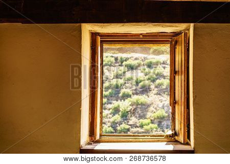 Window Frame Made Of Brown Wood. Old Construction, Ancient Architecture. Enterior Details.