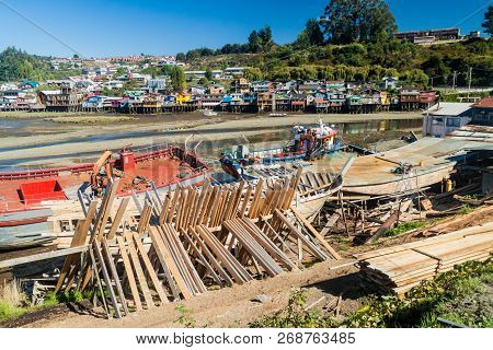 Fishing Boats And Palafitos Stilt Houses During Low Tide In Castro, Chiloe Island, Chile