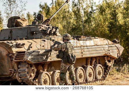 Group Of Soldiers On Tanks On The Outdoor On Army Exercises. War, Army, Technology And People Concep