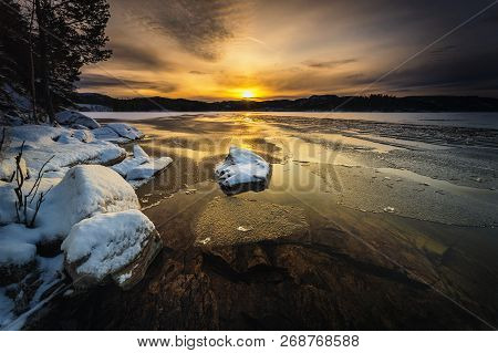 Sunset Sky Over Freezing Jonsvatnet Lake, Wintertime In Norway.