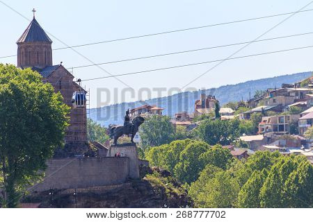 Metekhi Church And Monument To King Vakhtang Gorgasali On The Rock Over Kura River In Tbilisi, Georg