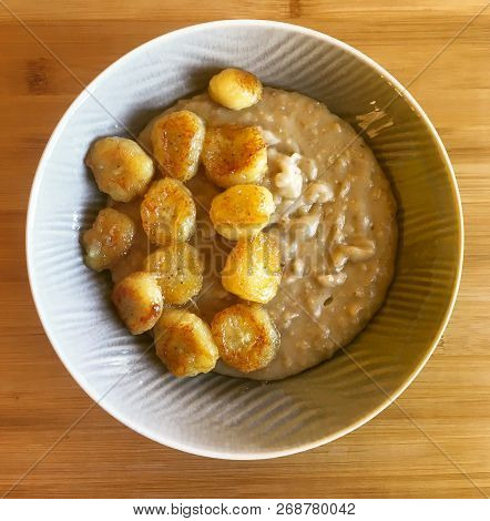 Breakfast Made Of Porridge And Grilled Banana