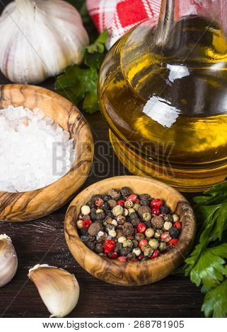Ingredients For Cooking On Wooden Background. Spices, Herbs And Oil. Free Space For Your Text.