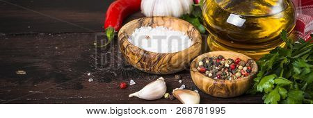 Ingredients For Cooking On Wooden Background. Spices, Herbs And Oil. Free Space For Your Text.
