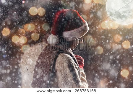 Christmas Gift Concept. Man In Santa Hat Bring Gift For You. Attractive Man Hold Box.  Christmas And