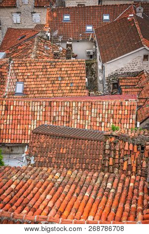 Aerial View Of The Red Tiled Houses Roofs Of Kotor Old Town, Montenegro