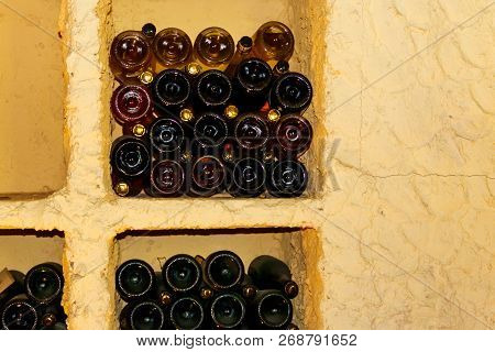 Many Champagne Bottles In A Wine Cellar