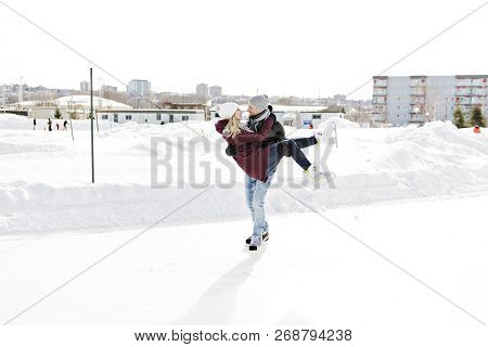 Couple In Sunny Winter Nature Ice Skating