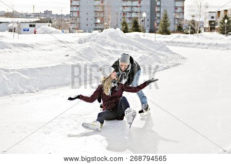 Couple In Sunny Winter Nature Ice Skating